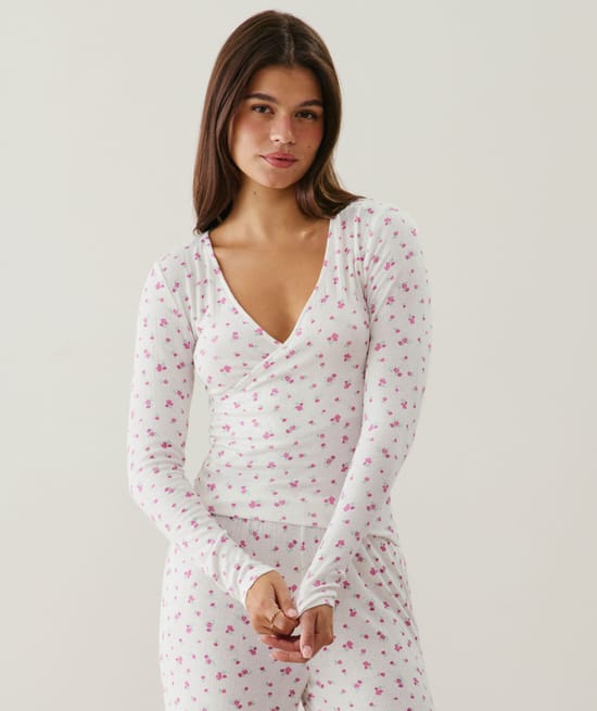 Wrap-front pointelle T-shirt with floral pattern;