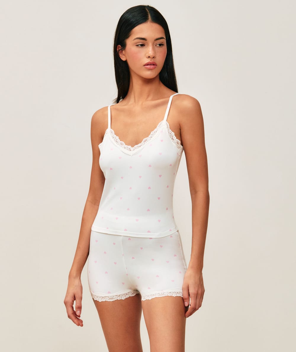 Jersey pajama set with heart patterns and lace;