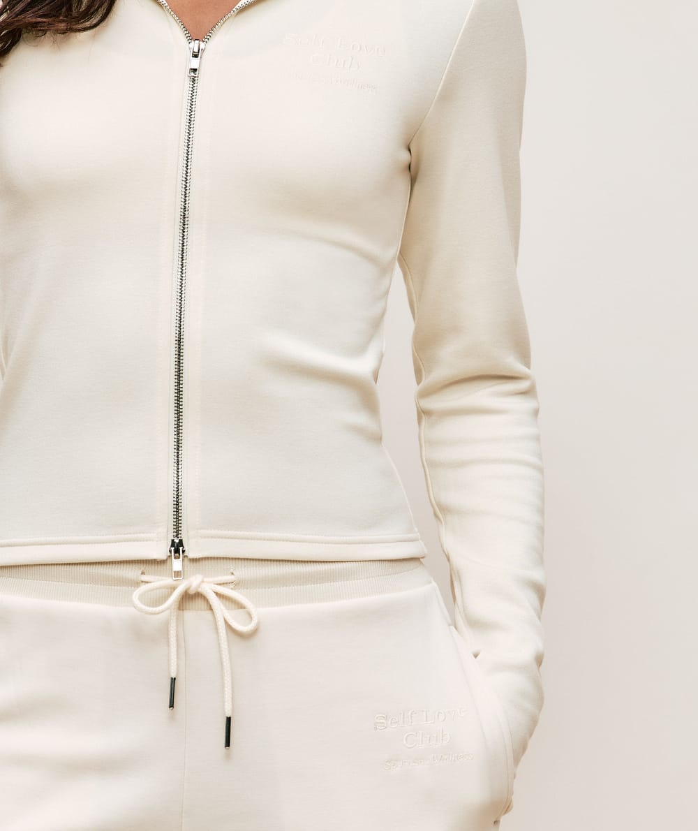 Jacket with Self Love Club embroidery;