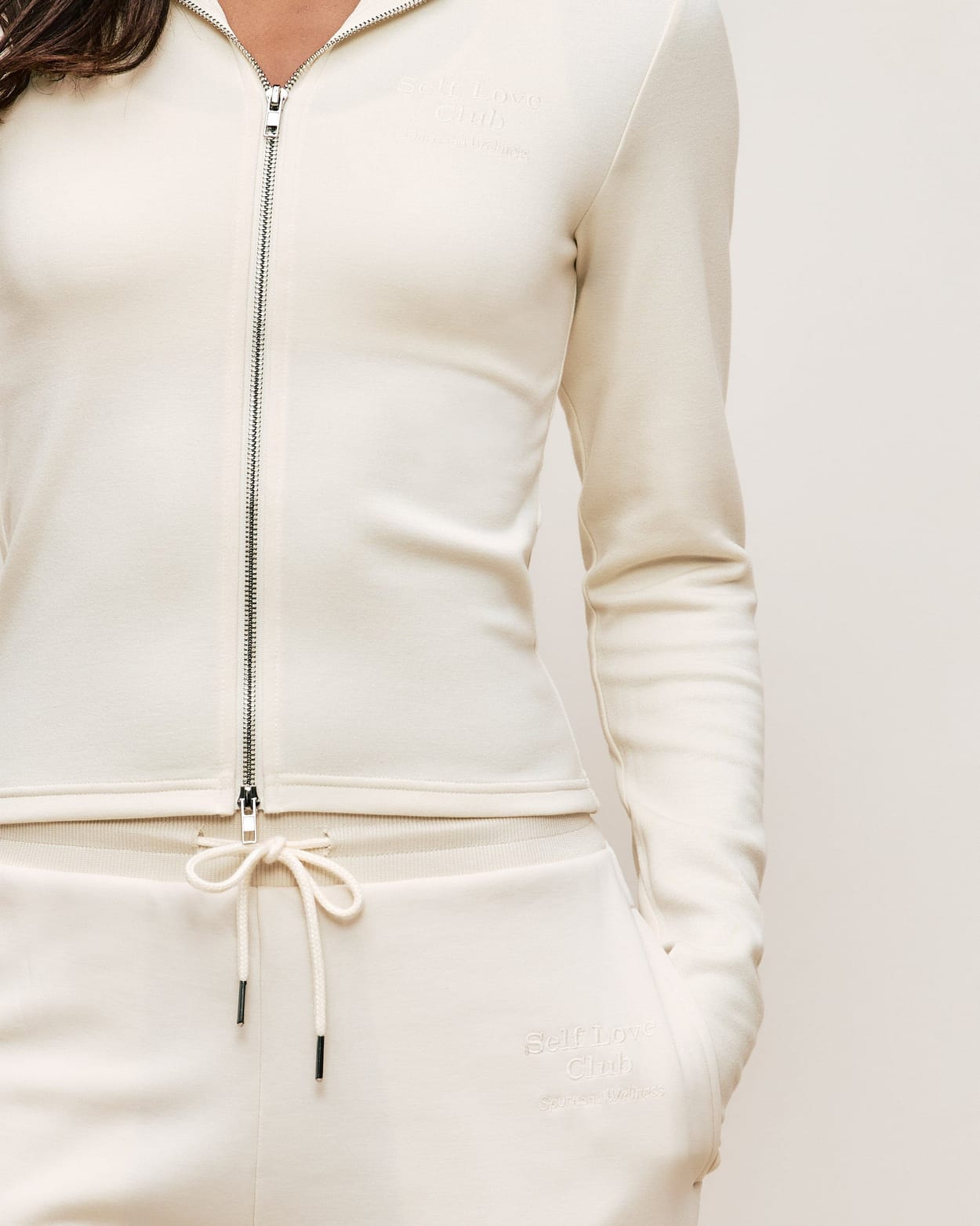 Jacket with Self Love Club embroidery;