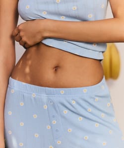 Sleeve pants in ribbed jersey with floral patterns;