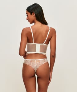 Mesh corset with floral embroidery and pearl pendant;