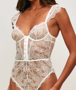 Lace backless bodysuit with shoulder pads;