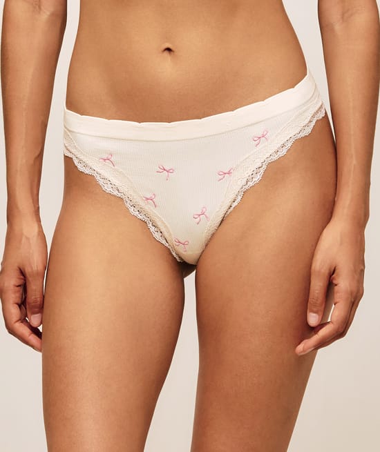 Tanga en seamless et dentelle brod&eacute;e de n&oelig;uds;