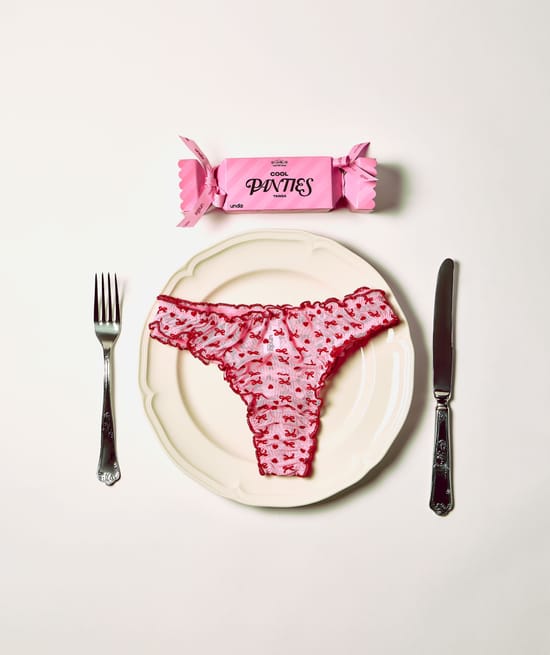 Mesh thong with heart and bow patterns;