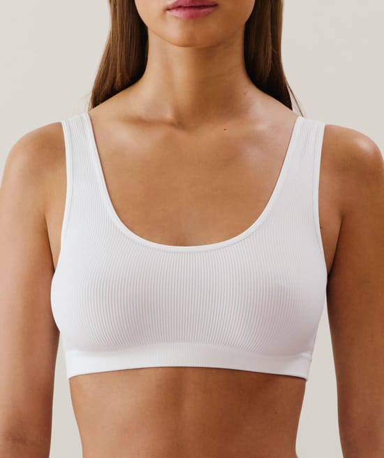 Ribbed seamless bralette in white;