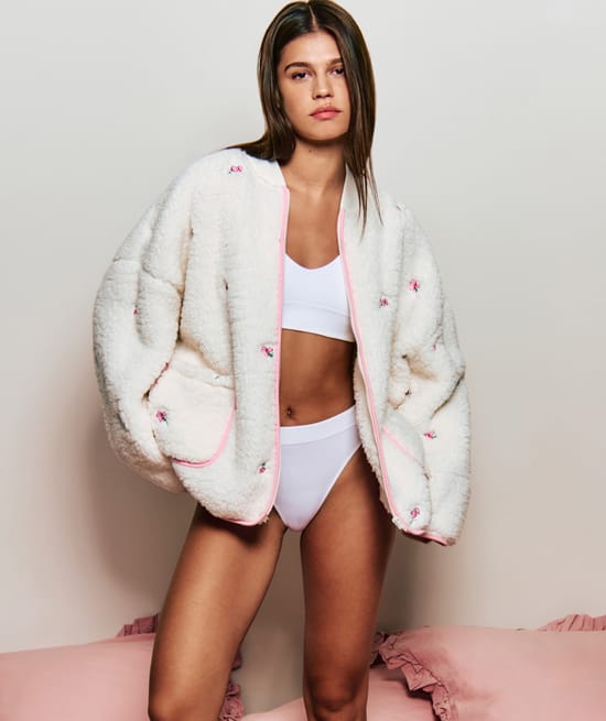 Fleece jacket with embroidered floral patterns;