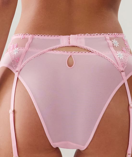 Suspender belt with embroidered floral patterns;