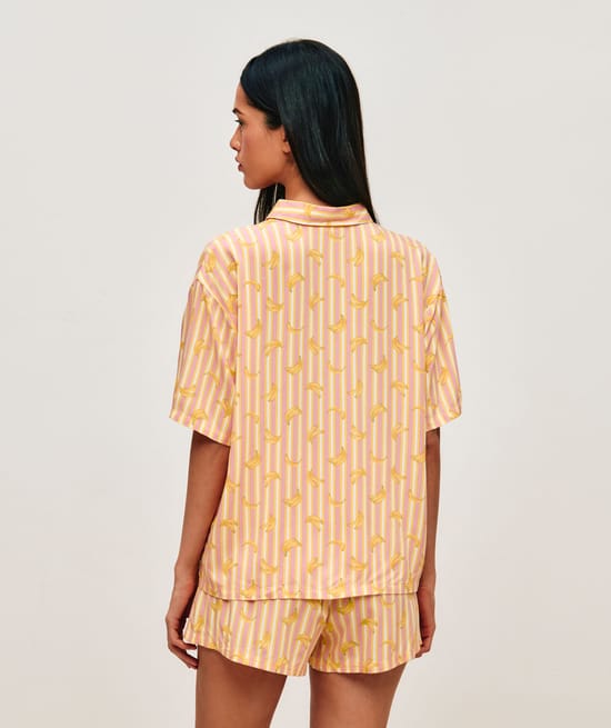 Striped shirt and shorts set with banana patterns;