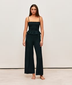 Black textured fabric pants;