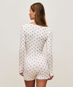 Long sleeve jersey playsuit with crescent patterns;
