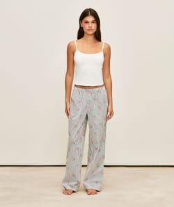 Striped trousers with bear print;
