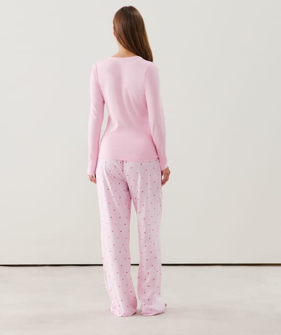 Flannel trousers with stripes and heart patterns;