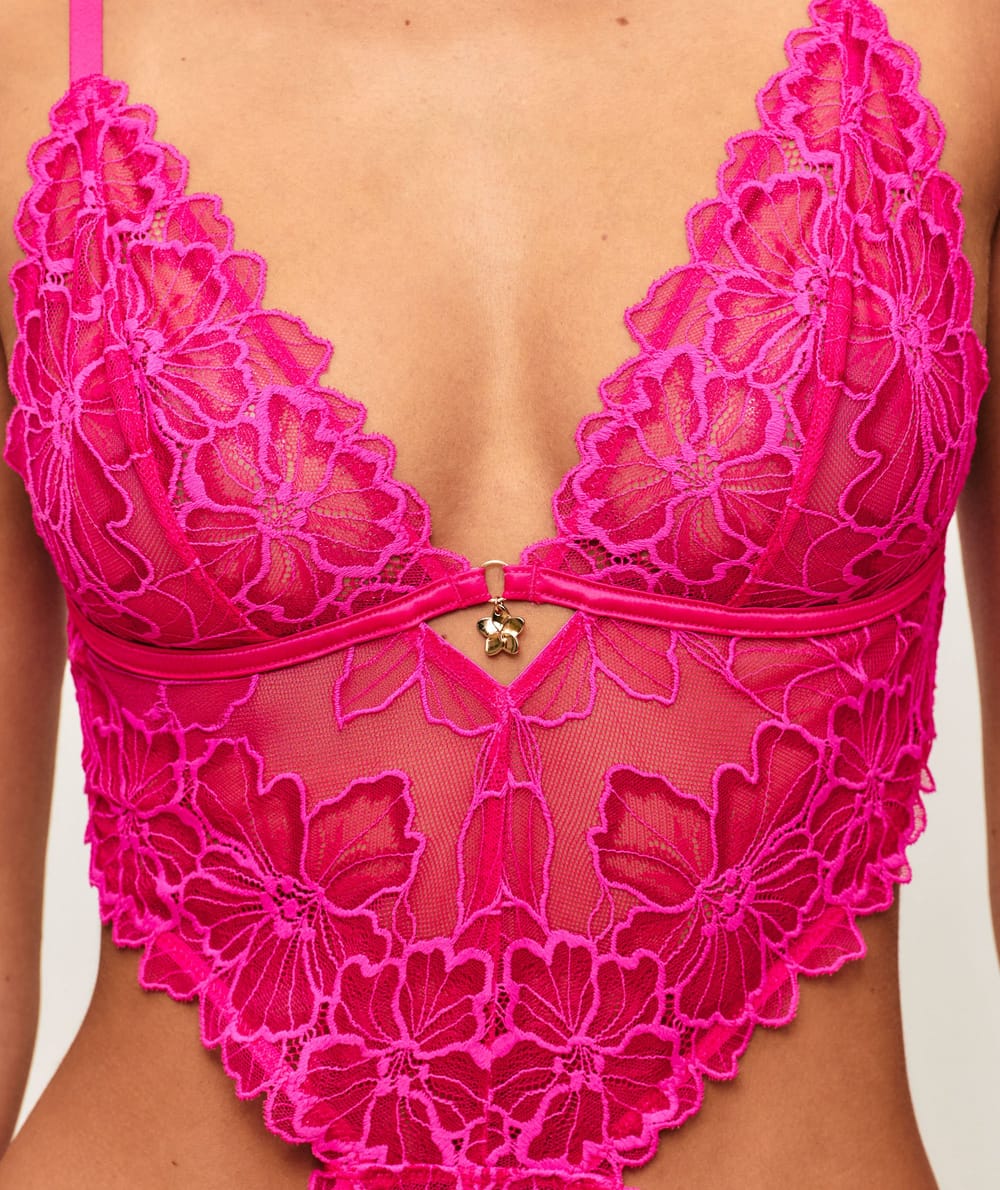 Lace body with floral embroidery and jewelry detail;