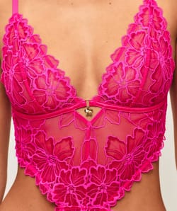 Lace body with floral embroidery and jewelry detail;