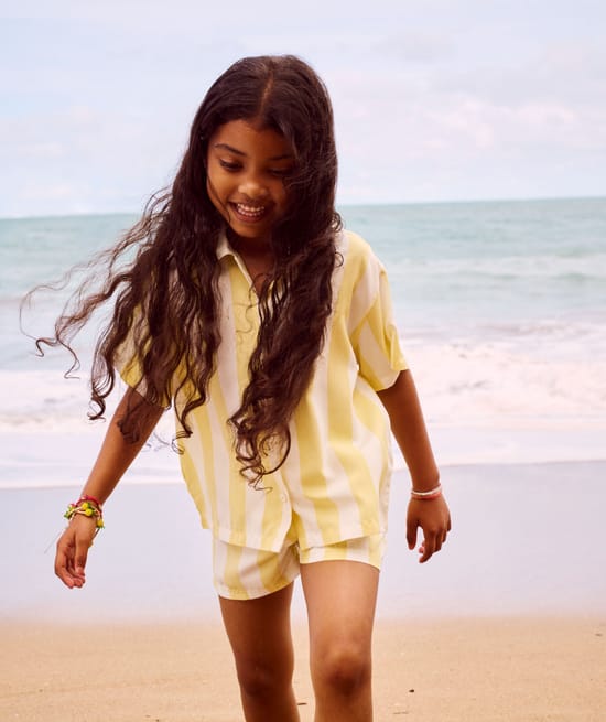 Short-sleeved shirt and striped print shorts;