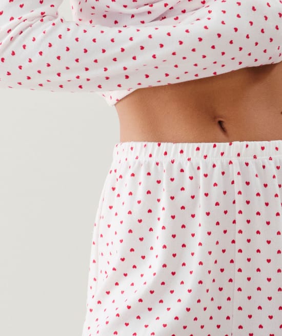 Thermocosy knitted trousers with red heart pattern;