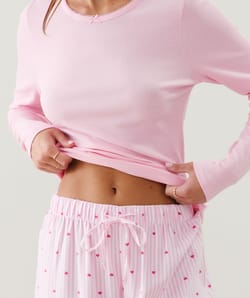 Flannel trousers with stripes and heart patterns;