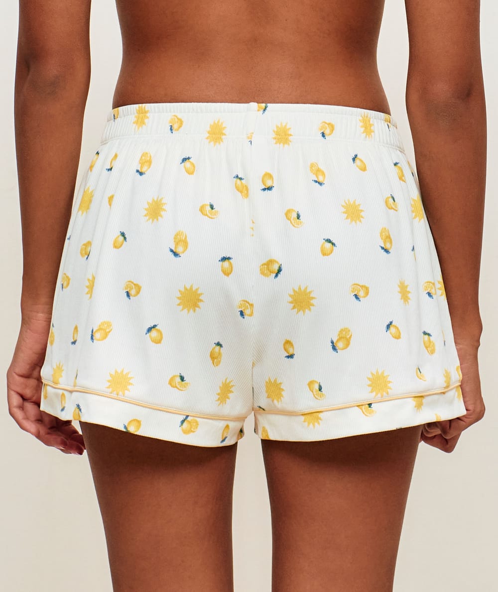 Short en jersey c&ocirc;tel&eacute; avec motifs soleils et citrons ;