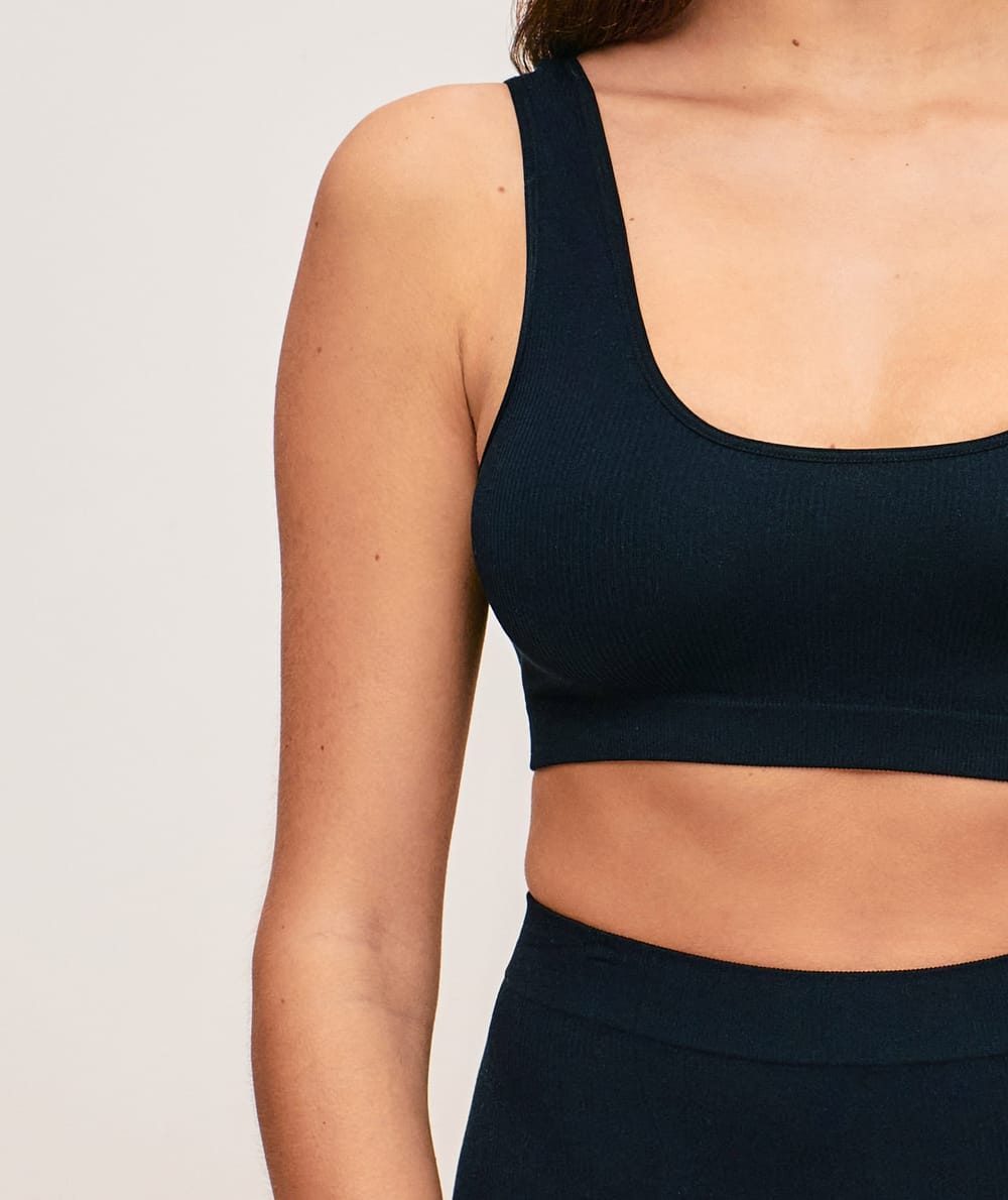 Seamless ribbed bralette in black;