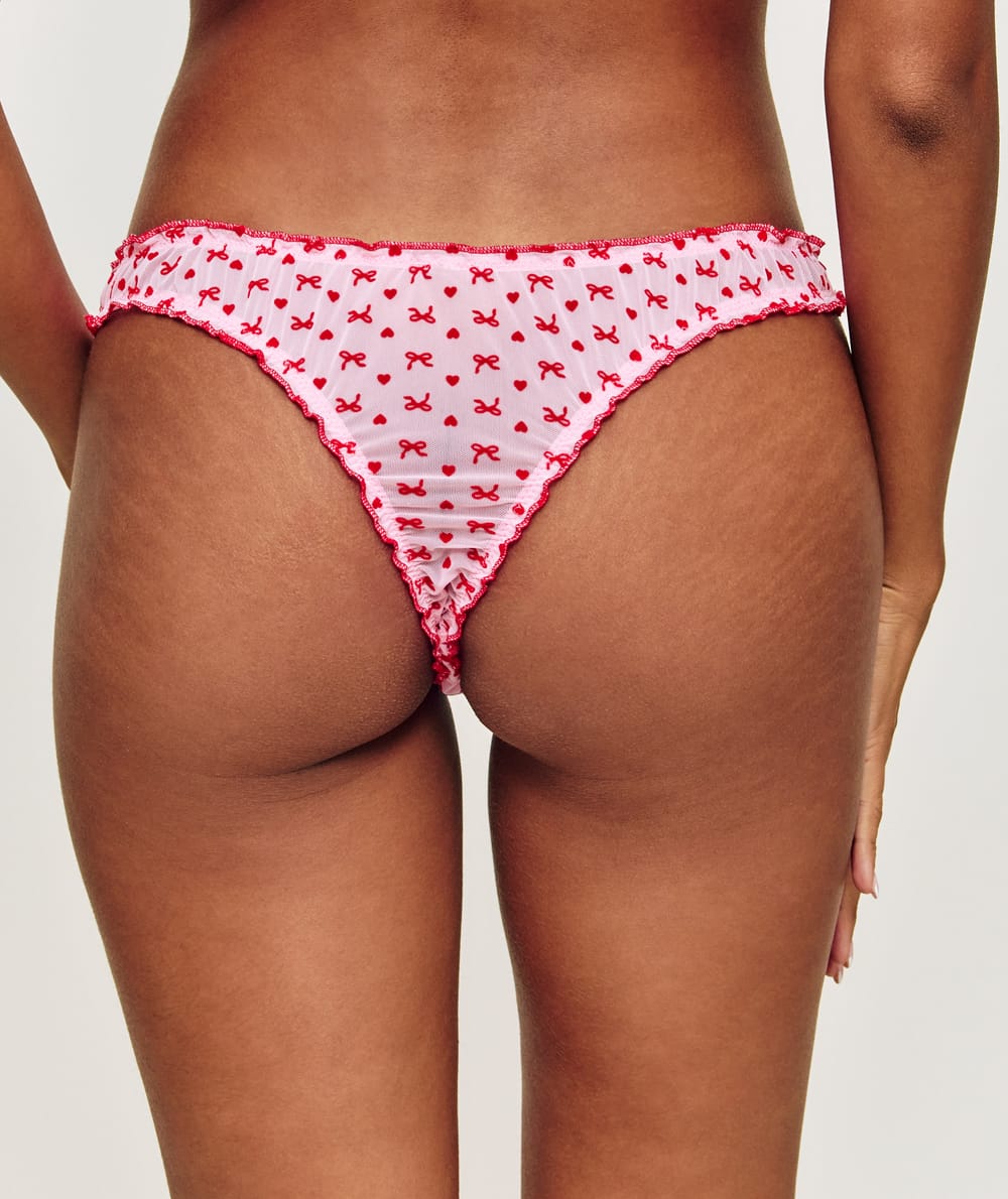 Mesh thong with heart and bow patterns;