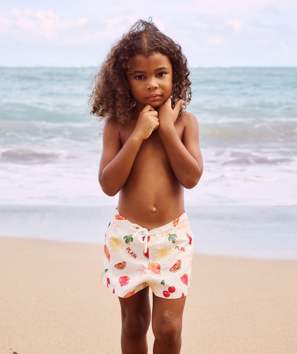 Kids' swimsuit shorts with fruity and floral pattern;
