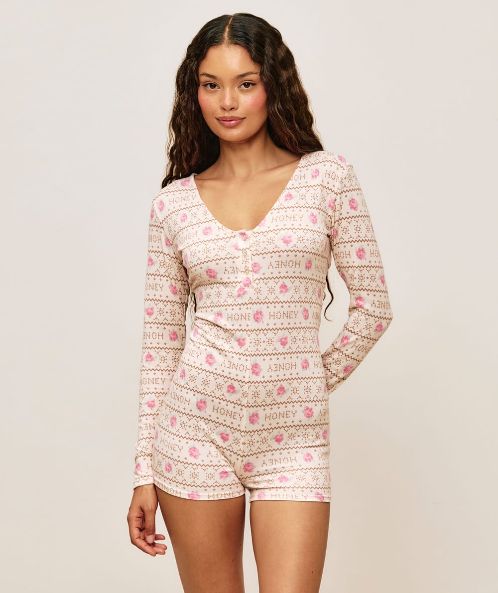 Jersey playsuit with floral patterns;