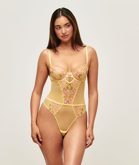 Body string in tulle with flower embroidery;