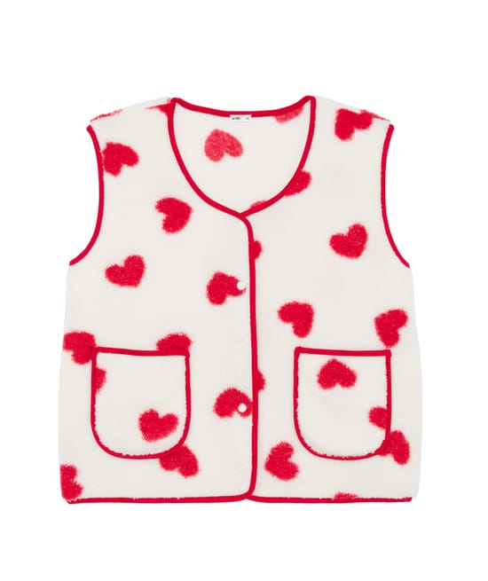Sleeveless sherpa jacket with red heart pattern;