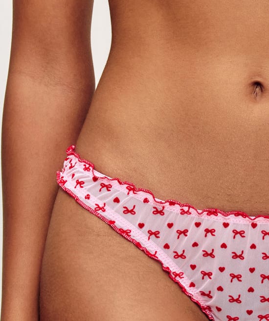 Mesh thong with heart and bow patterns;
