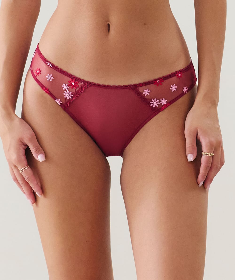 Brief with embroidered floral patterns;