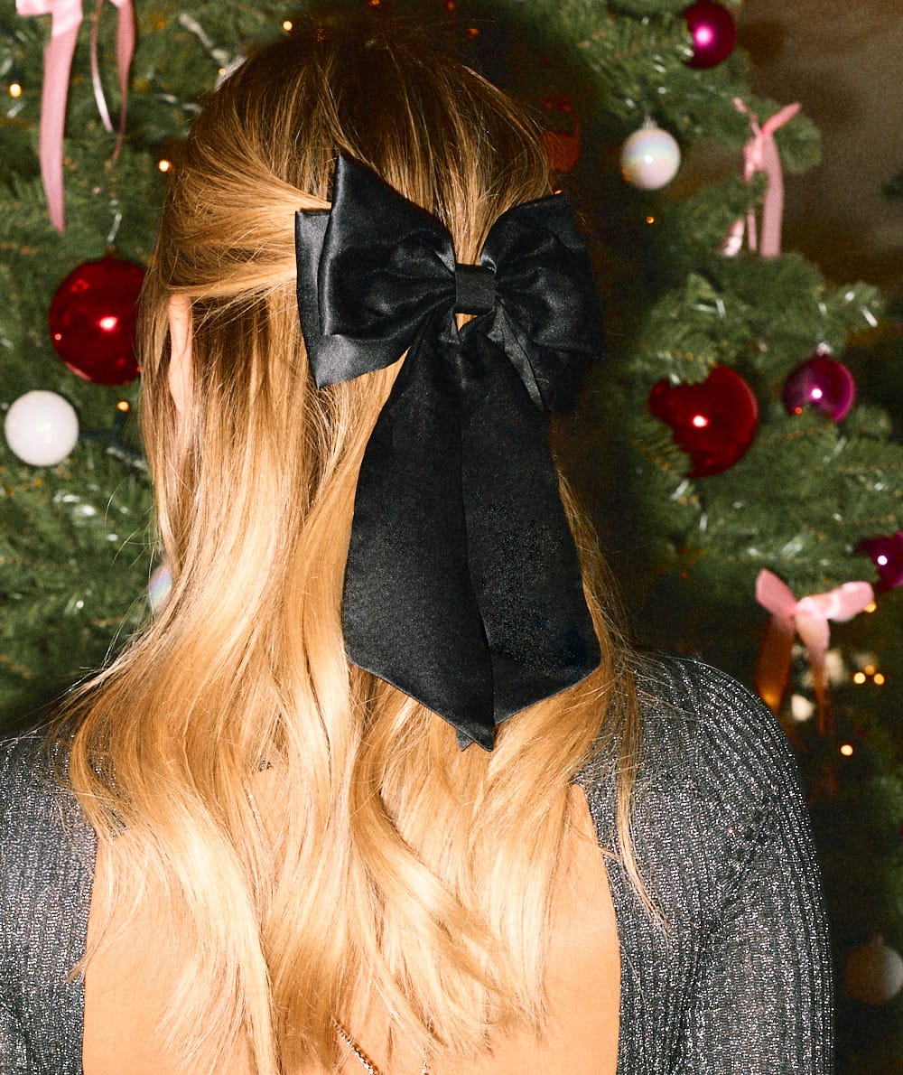 Black satin bow hair clip;