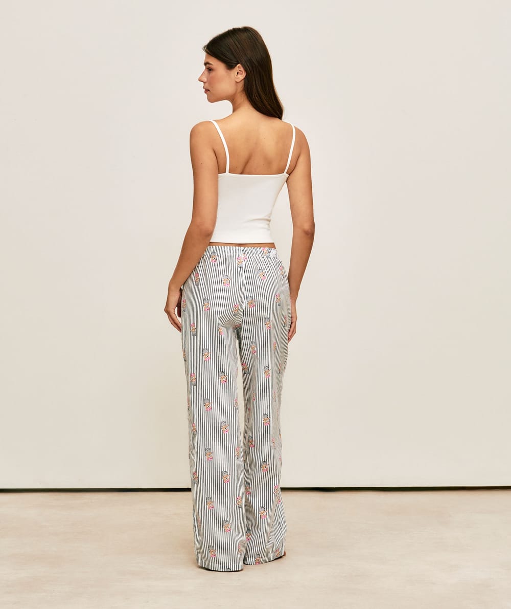 Striped trousers with bear print;