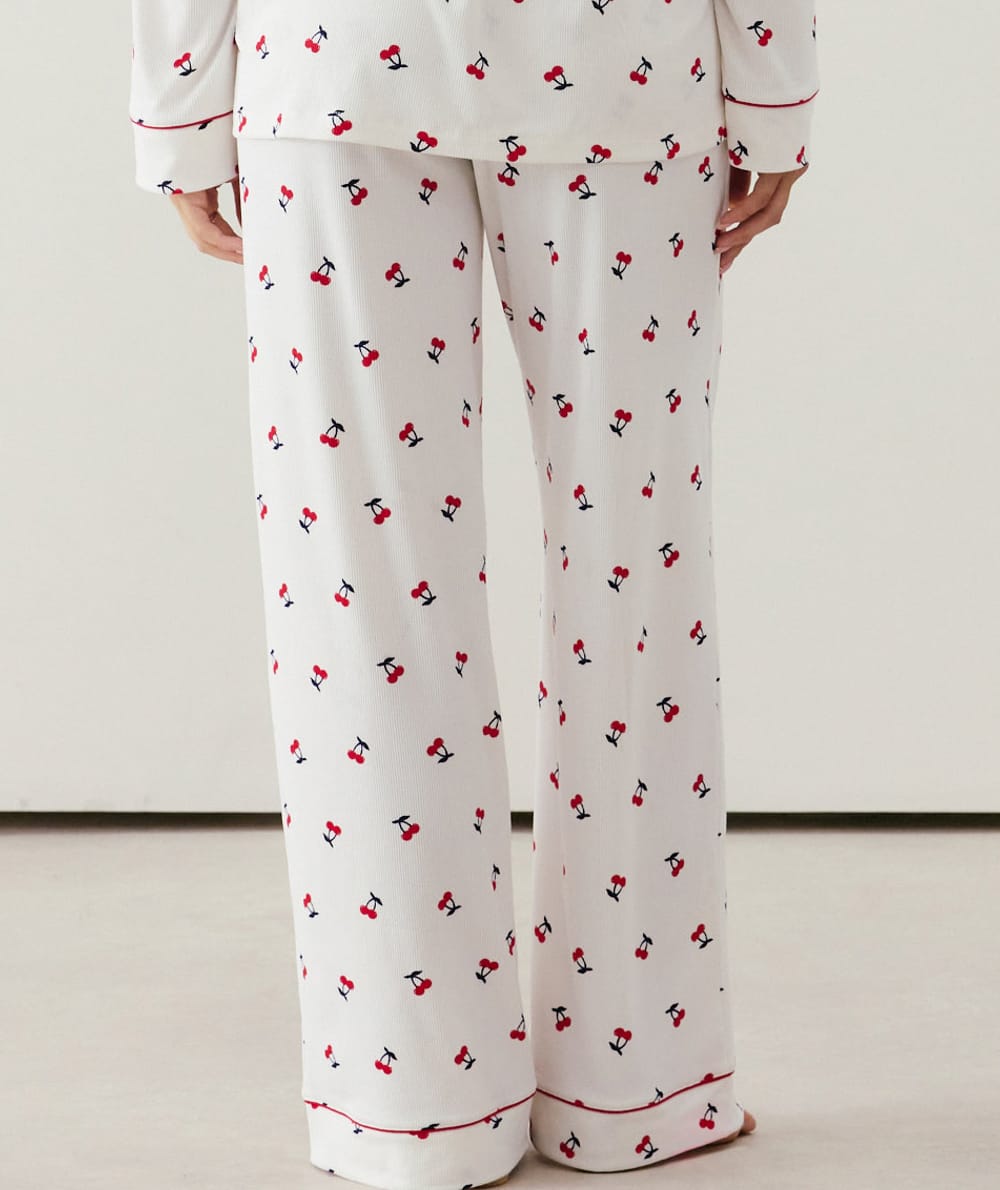 Ribbed jersey trousers with cherry pattern;