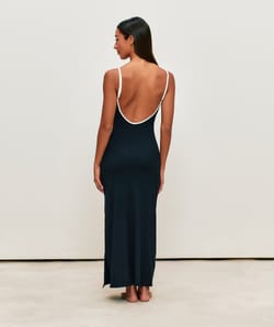 Form-fitting ribbed long dress with open back and integrated cups;