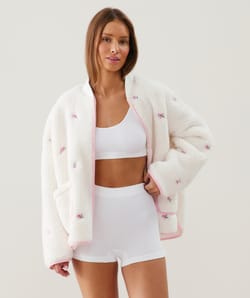 Fleece jacket with embroidered floral patterns;