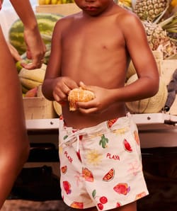 Kids' swimsuit shorts with fruity and floral pattern;