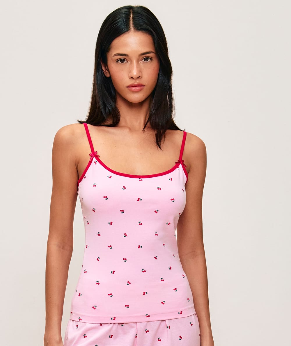 Tank top with adjustable straps featuring a cherry pattern;