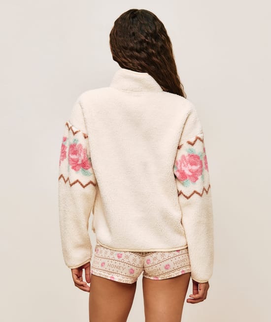 Floral patterned sherpa fleece jacket;
