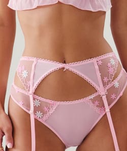 Suspender belt with embroidered floral patterns;