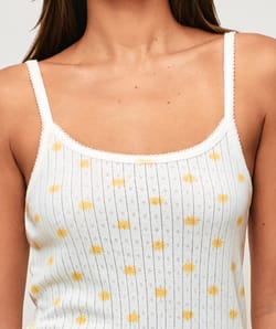 Fine strap tank top in printed lace suns;