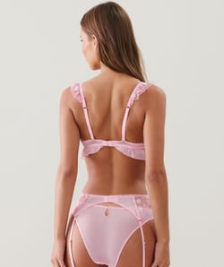 Suspender belt with embroidered floral patterns;