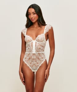 Lace backless bodysuit with shoulder pads;