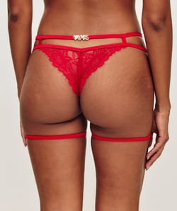 Lace and satin thong and suspender belt;
