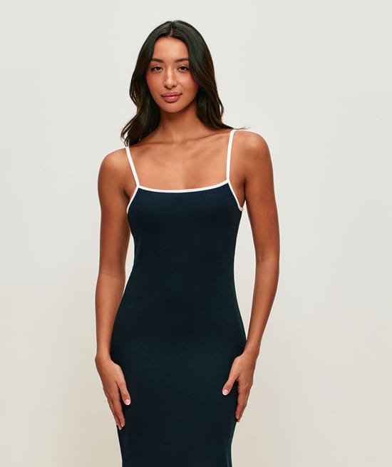 Form-fitting ribbed long dress with open back and integrated cups;