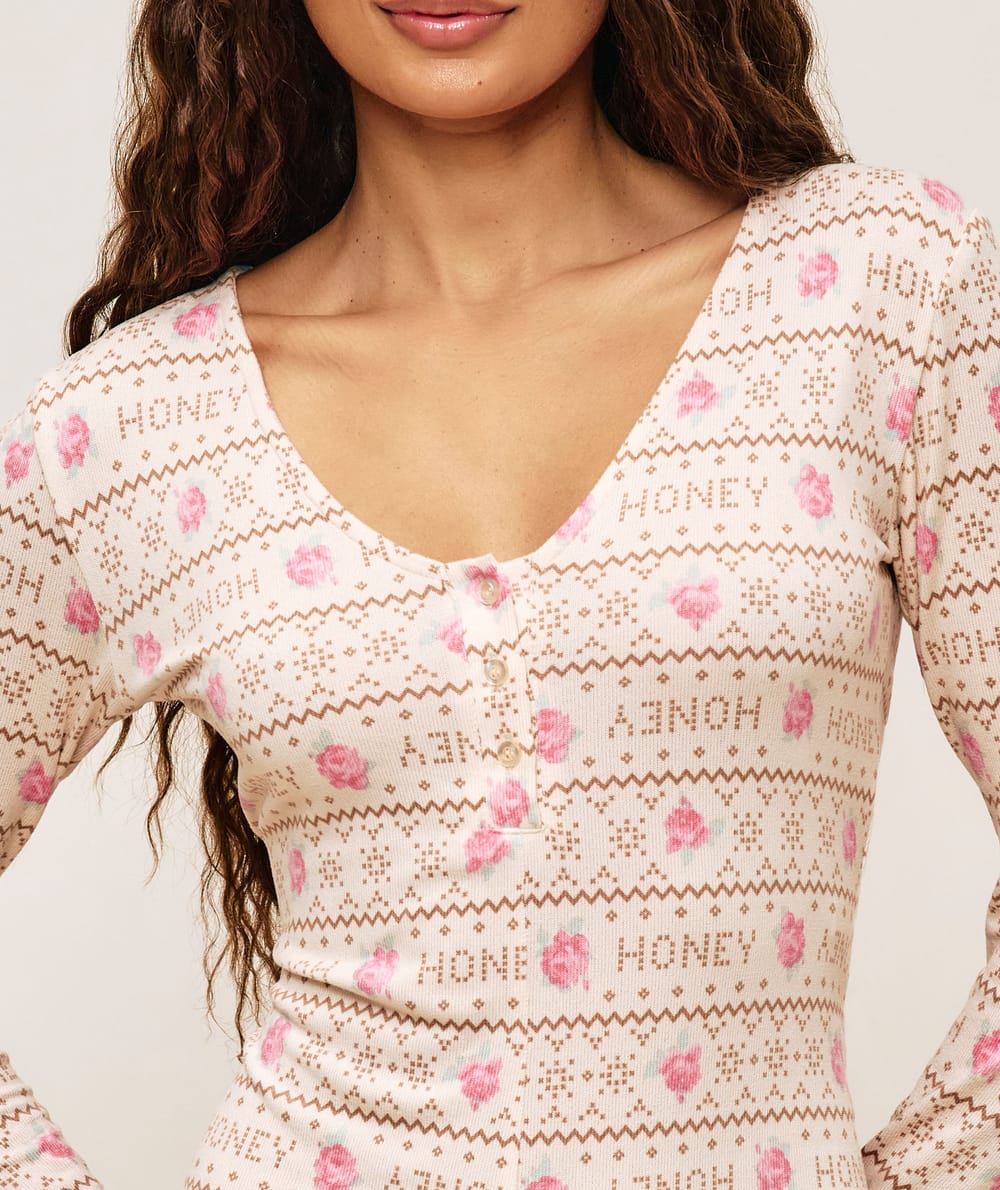 Jersey playsuit with floral patterns;