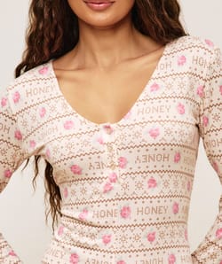 Jersey playsuit with floral patterns;