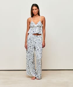 Satin crop top with V-neck, thin straps, and ruffles;
