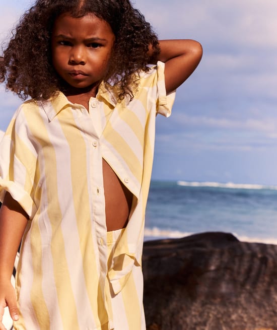 Short-sleeved shirt and striped print shorts;